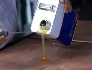 Sealant being poured onto a surface