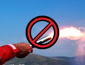 A hand holds a flare