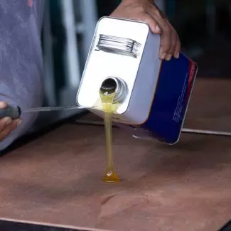 Sealant being poured onto a surface